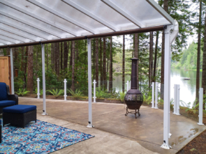 White frameless glass railing on patio overlooking a lake